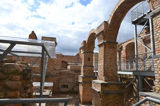 View restored to the ruins with stairs of an old castle in Europe