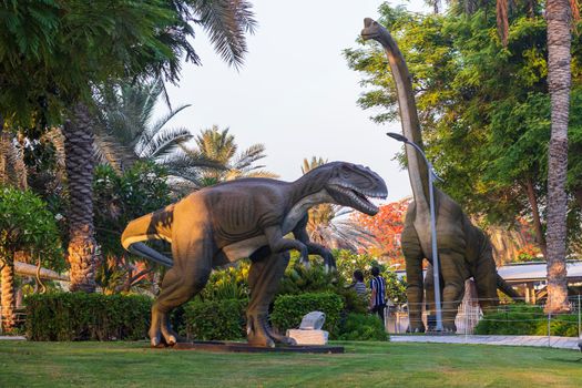 Dubai,UAE - 05.11.2021 - Austrosaurus and T rex replicas exhibits at dinosaur park.