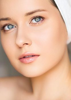 Skin care and beauty routine, beautiful woman with white towel wrapped around head, skincare cosmetics and face cosmetology, close-up portrait