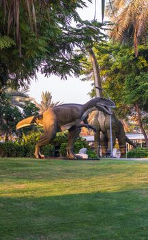 Dubai,UAE - 05.11.2021 - Austrosaurus and T rex replicas exhibits at dinosaur park.
