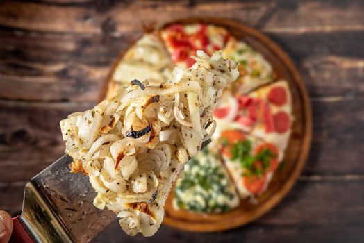 Assorted handmade Argentinian pizza on stone background