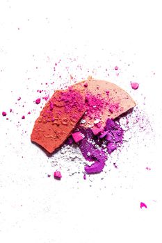 Beauty texture, cosmetic product and art of make-up concept - Crushed eyeshadow palette and powder close-up isolated on white background