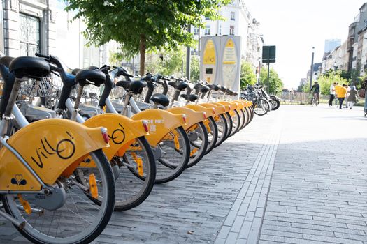 BRUSSELS,BELGIUM - June 02, 2022: public Villo bicycles parked in the sharing, High quality photo