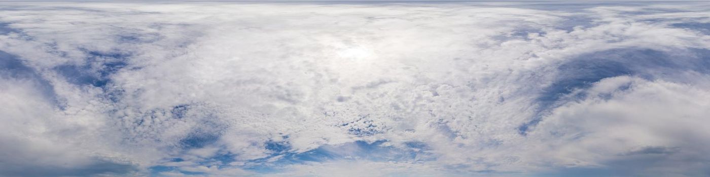 Blue sky with Cumulus clouds Seamless panorama in spherical equirectangular format. Complete zenith for use in 3D graphics, game and for composites in aerial drone 360 degree panoramas as a sky dome.