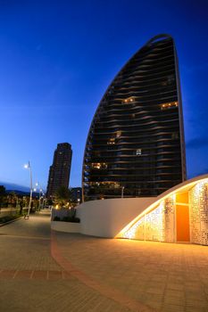 Benidorm, Alicante, Spain- September 11, 2022: Modern architecture buildings called Sunset Waves on the Poniente Beach Area in Benidorm at night