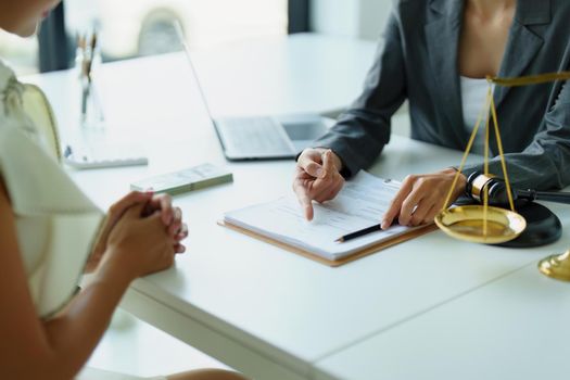 Law and legitimacy, portrait of lawyer and client signing important contract documents.