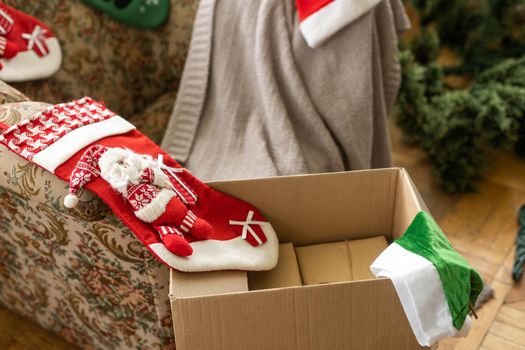 Christmas Eve. red color decorated sock hanging on christmas tree with bokeh light background, holiday family, happy new year and merry christmas festival concept, vintage color tone effect.