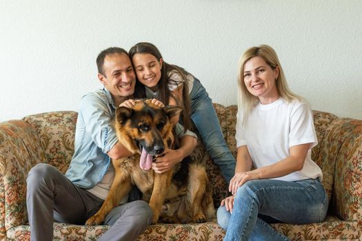 german shepherd and family. German shepherd is the best friend of the child