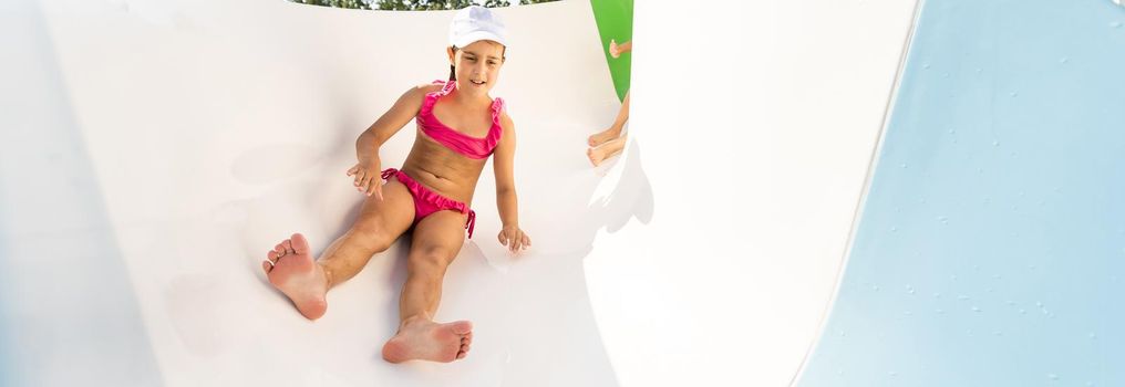 Happy child playing in swimming pool. Summer vacation concept.