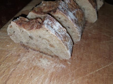 Sprouted bread cut and placed on a the wooden stand