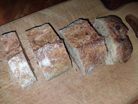 Sprouted bread cut and placed on a the wooden stand