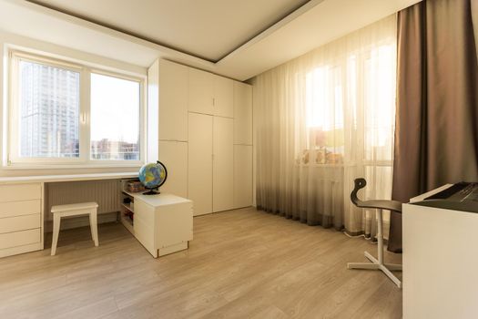 Workspace with desk and chair in modern room for children. Working table in kid's room