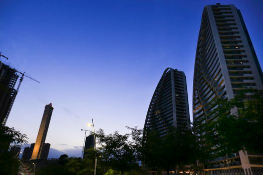 Benidorm, Alicante, Spain- September 11, 2022: Modern architecture buildings called Sunset Waves on the Poniente Beach Area in Benidorm at night