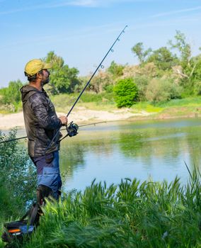 fishing session in the ebro river adult man with beard carp fishing