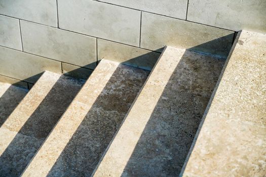 Staircase in the city, black and white pattern on the stairs on a sunny day