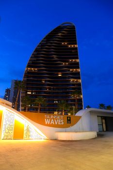 Benidorm, Alicante, Spain- September 11, 2022: Modern architecture buildings called Sunset Waves on the Poniente Beach Area in Benidorm at night