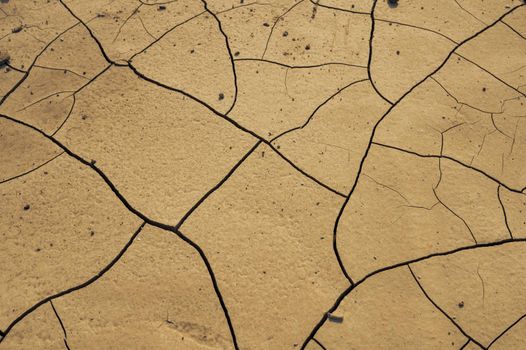 The ground with cracks for the background. Concept of crisis environment.