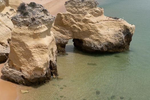 The rocky cliffs of Vale do Olival beach in Armacao de Pera, Portugal. High quality 4k footage