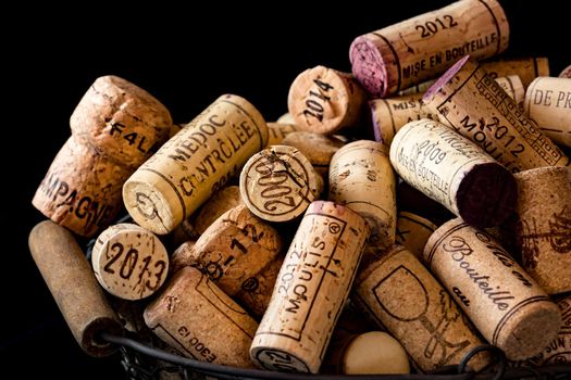 old cork stoppers of French wines in a wire basket