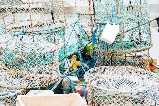 crab and lobster pots on a pontoon covered with morning frost