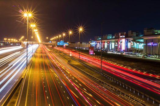 Dubai, UAE - 02.22.2021 Shot of a night road with light trails.