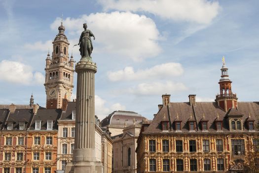 Historic facades at the Grand Place in the city of Lille, the belfry of the Chambre de Commerce in background.