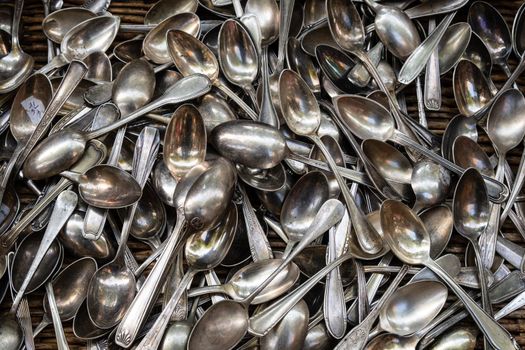 Heap of aged vintage silver spoons