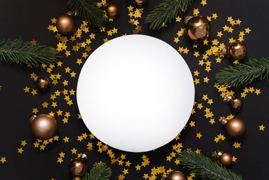White mock up for a designer on a black Christmas background with golden balls, confetti and Christmas tree branches