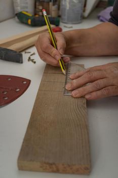 taking measurements on a wooden cutting board