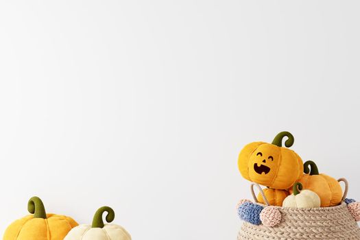 Halloween copyspace background with pumpkins in basket on white background, smiling pumpkin face, 3D rendering, Halloween theme with pumpkins in woven basket on white background 3D illustration.