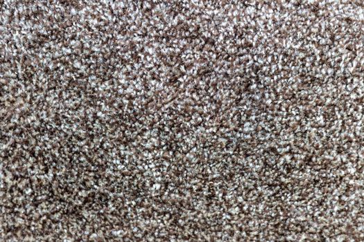 Brown carpet texture background closeup view