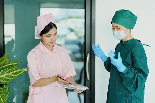 Portrait of doctor and nurse talking to prepare before going to the emergency room to treat patients.