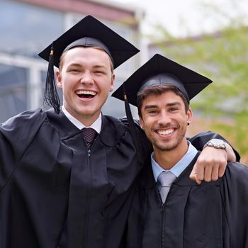 Set for life. a friends at their graduation ceremony