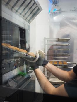 baker baking cooking in the kitchen of a lab