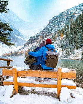 Lake Agnes Canada near Lake Louise Canada Alberta. Couple hiking in the forest with snow by Lake Louise Canada Alberta Canadian Rockies during winter