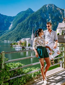 Hallstatt Austria, couple visit Hallstatt during summer vacation Hallstatter lake.