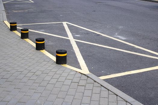 Sign on the asphalt with no parking close up