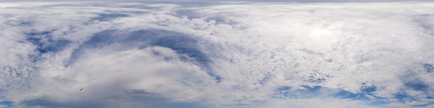 Blue sky with Cumulus clouds Seamless panorama in spherical equirectangular format. Complete zenith for use in 3D graphics, game and for composites in aerial drone 360 degree panoramas as a sky dome.