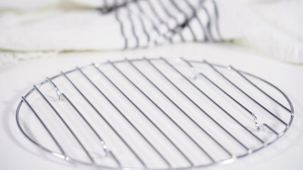 White and black kitchen towel on a white countertop.