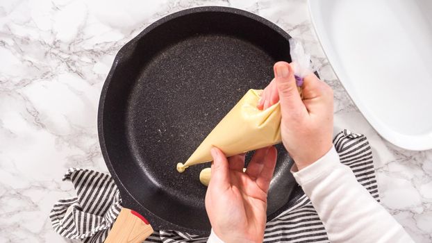 Flat lay. Step by step. Frying mini pancake cereal in a nonstick frying pan.