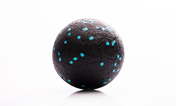 Massage therapy ball for muscle relaxation. Medical equipment for body recovery and stress relief