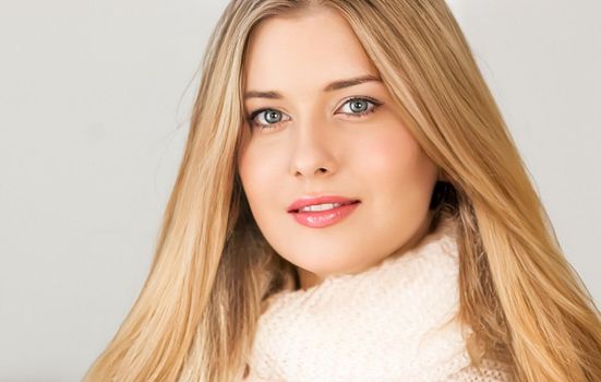 Autumn winter fashion and knitwear, beautiful woman wearing warm knitted scarf, close-up portrait