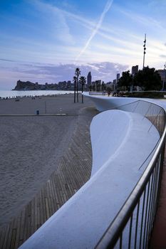 Benidorm, Alicante, Spain- September 11, 2022: Poniente beach with its beautiful promenade with access to the beach and viewpoint with modern design