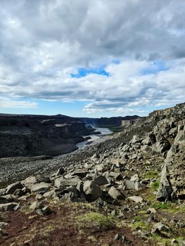 Fantastic landscape with flowing rivers and streams with rocks and grass in Iceland 