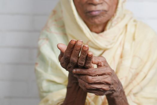 Elderly woman suffering from pain ,