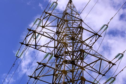 Power plant tower close-up against the blue sky. Energy crisis concept.