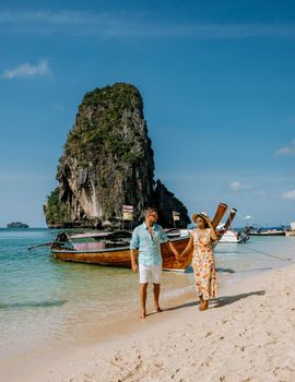 Koh Poda Island Krabi Thailand, couple mid age Asian woman and a European man on the beach, Koh Poda Thailand, the beautiful tropical beach of Koh Poda, Poda Island in Krabi province