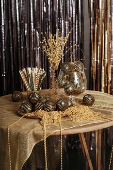 Bright Christmas decor. Christmas and New Year interior in black and gold colors. Winter holiday background.