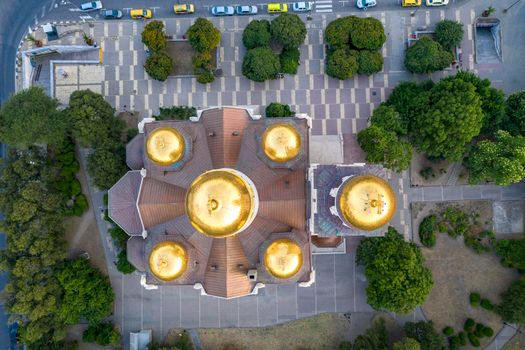 Aerial top view of the golden roof of The Cathedral of the Assumption in Varna, Bulgaria