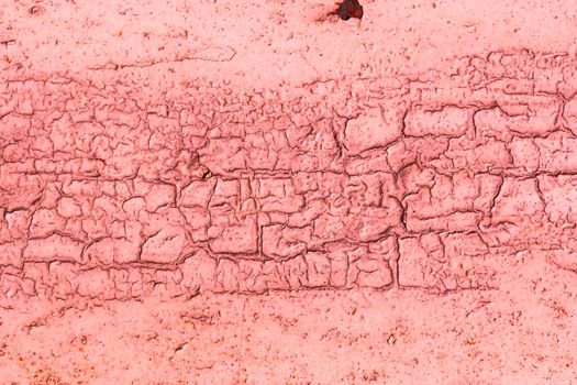 Texture of cracked old red paint on wall. Abstract pink background for copy spaced design.
